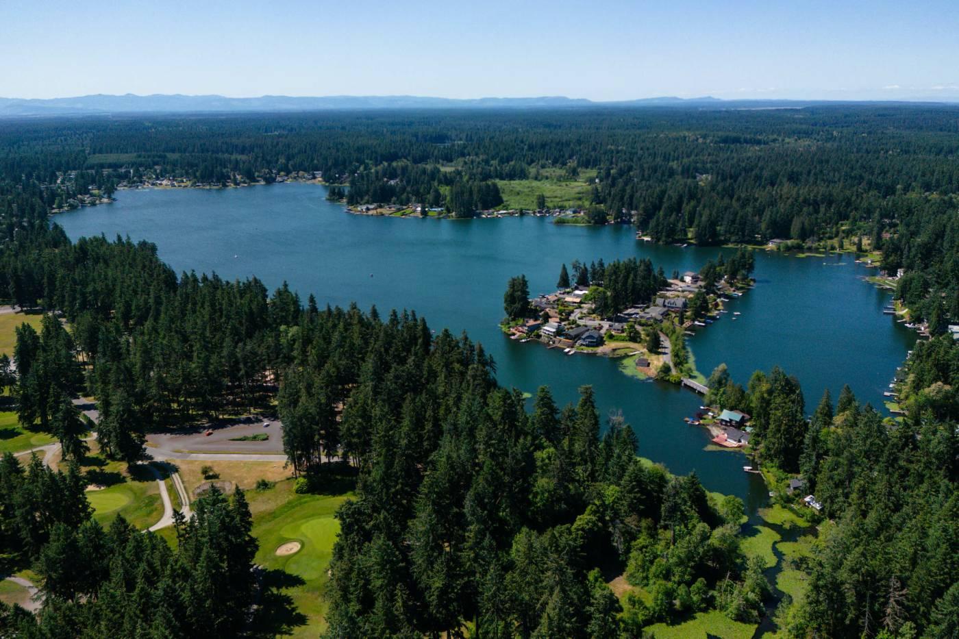 Aerial view of Spanaway Lake and homes