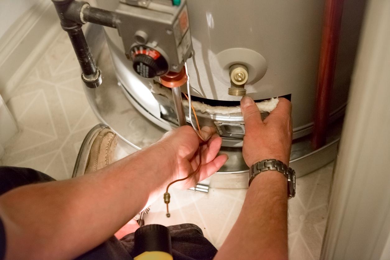 Plumber installing a new water heater